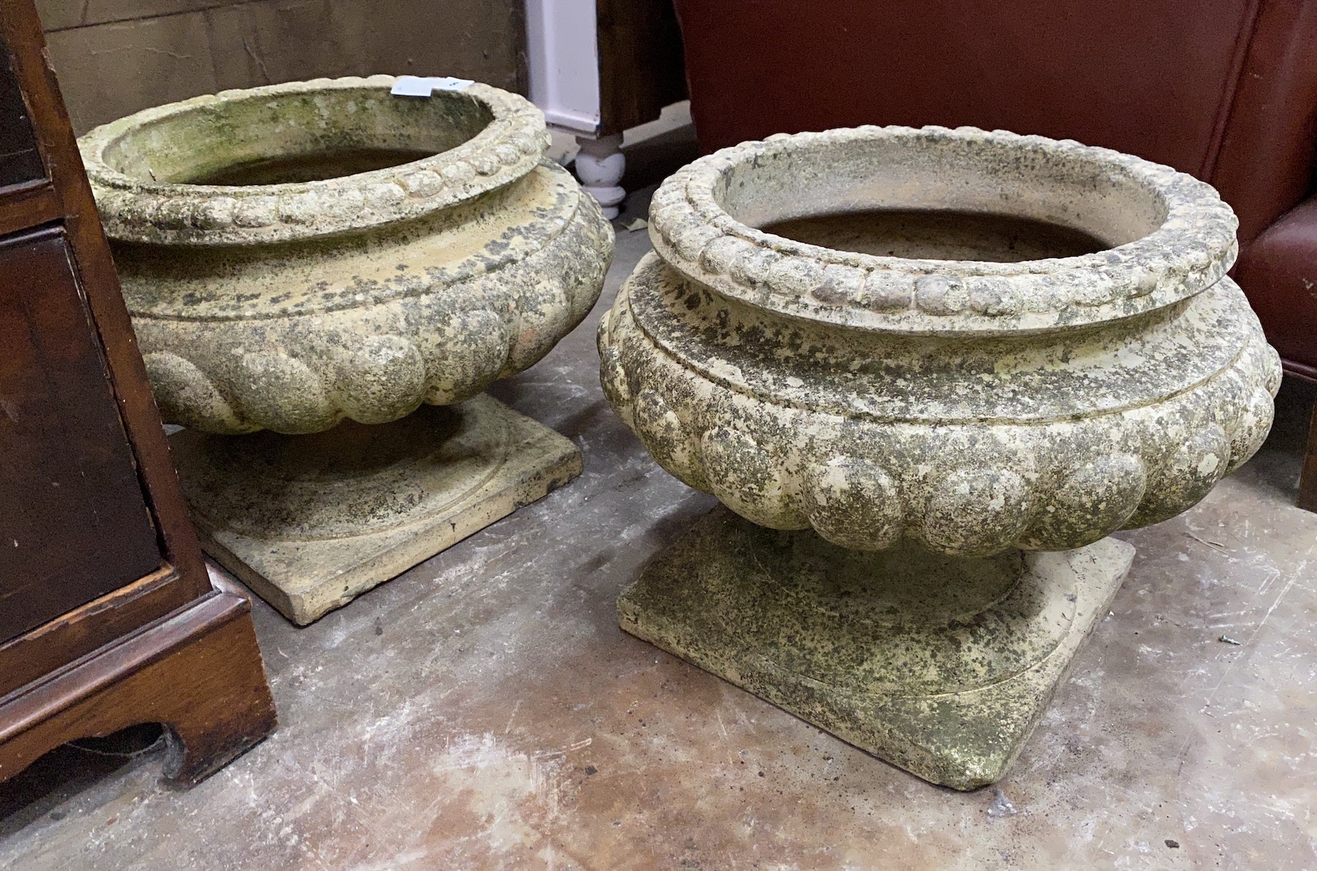 A pair of reconstituted stone circular garden planters, diameter 46cm, height 34cm